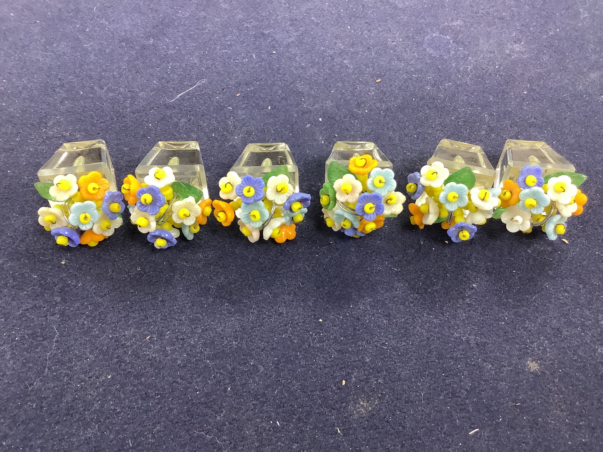 A boxed set of six Czechoslovakian glass flower menu holders, height 3.5cm